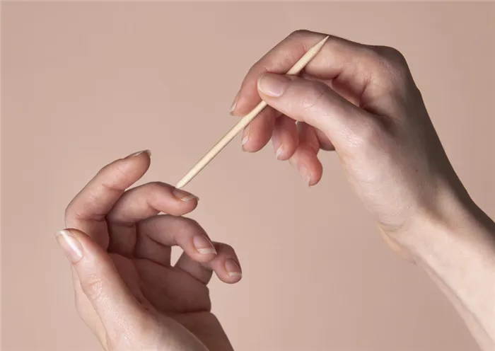 front-view-woman-taking-care-of-her-nails.jpg